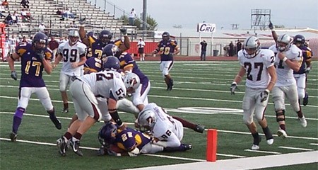 UMHB senior running back Jarvis Thrasher (22) ties the American Southwest Conference single-season record for rushing touchdowns with his 23rd during the fourth quarter of the Cru's 52-23 first-round playoff win over Trinity.