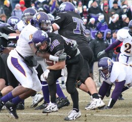 UMHB linebacker Jerrell Freeman tackles UW-Whitewater running back Justin Beaver (32), a fellow all-American, during the Cru's 16-7 national semifinal loss on Saturday, December 8, 2007.