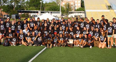 The McMurry men and women celebrate sweeping the ASC titles for the fourth straight year.